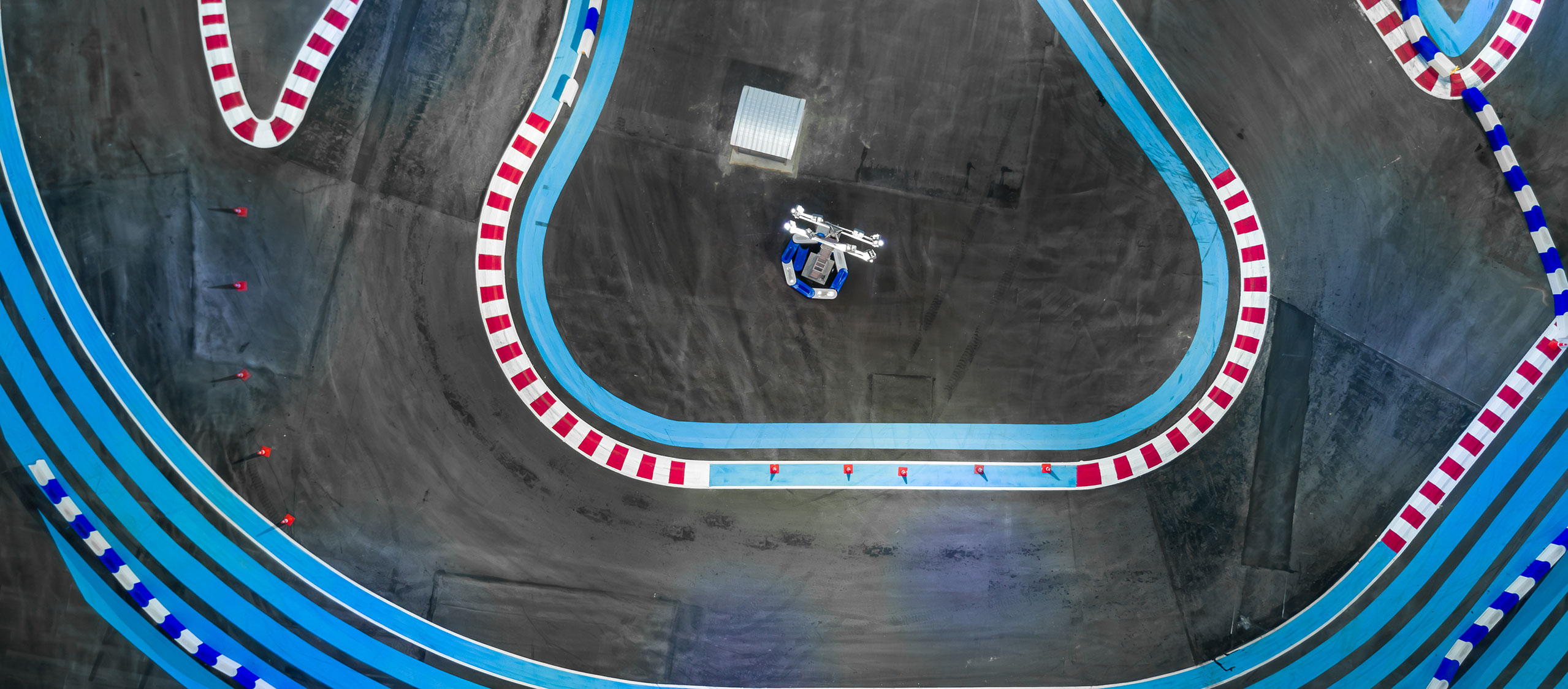 Aerial view of go cart track with blue outer lines
